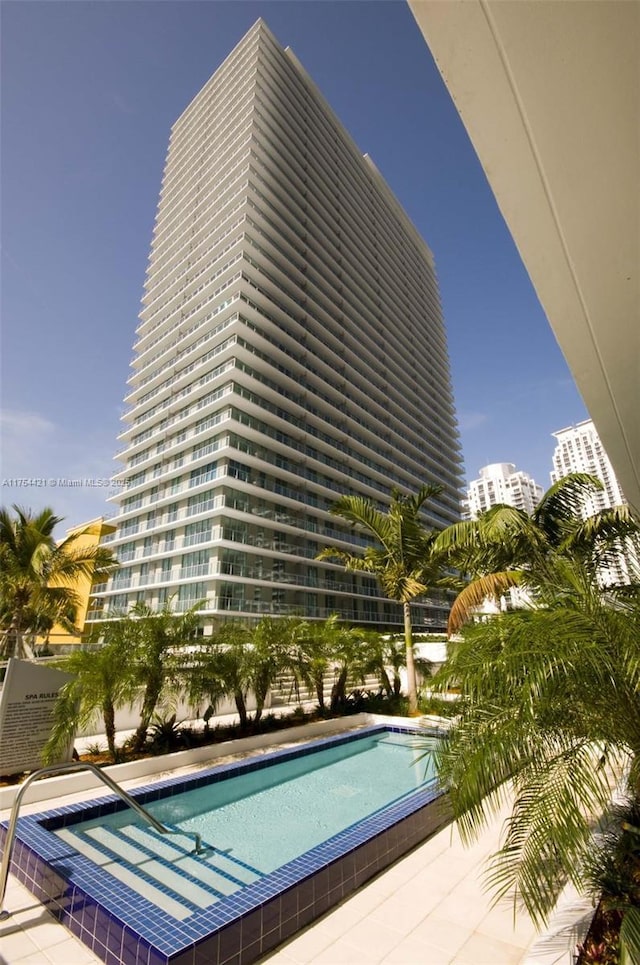 community pool with a city view