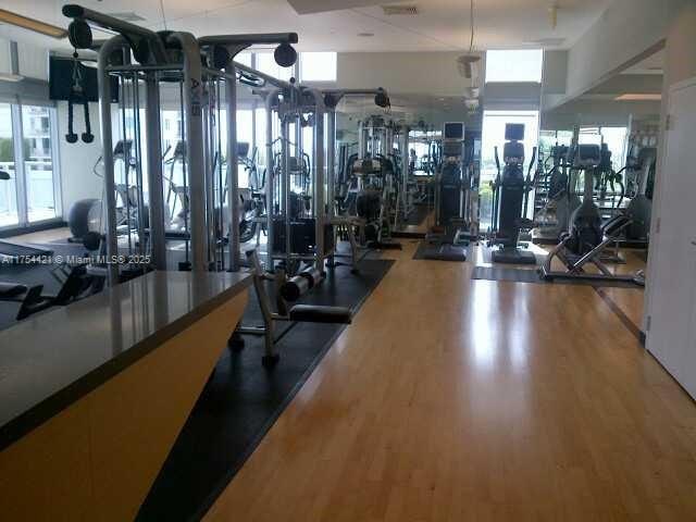 gym with wood finished floors