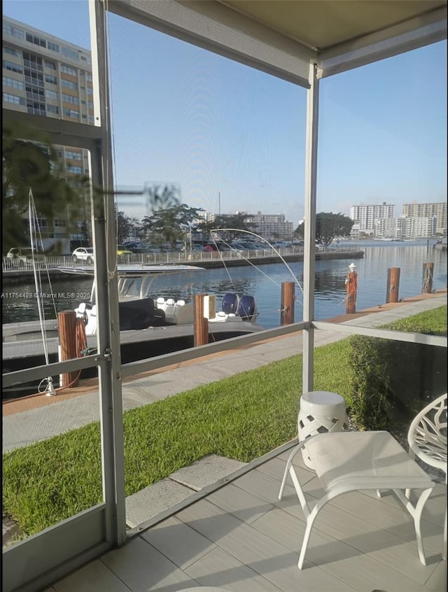 2600 Diana Dr Unit 103, Hallandale Beach, FL 33009 - sunroom / solarium featuring a water view and a view of city