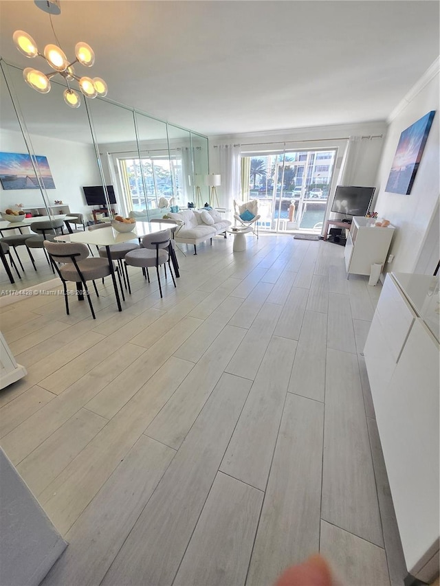 2600 Diana Dr Unit 103, Hallandale Beach, FL 33009 - dining room featuring a chandelier and wood finished floors
