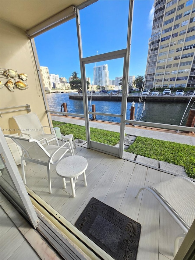 2600 Diana Dr Unit 103, Hallandale Beach, FL 33009 - sunroom featuring a water view and a view of city