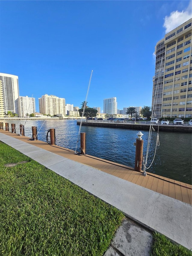 dock area featuring a view of city, a water view, and central air condition unit