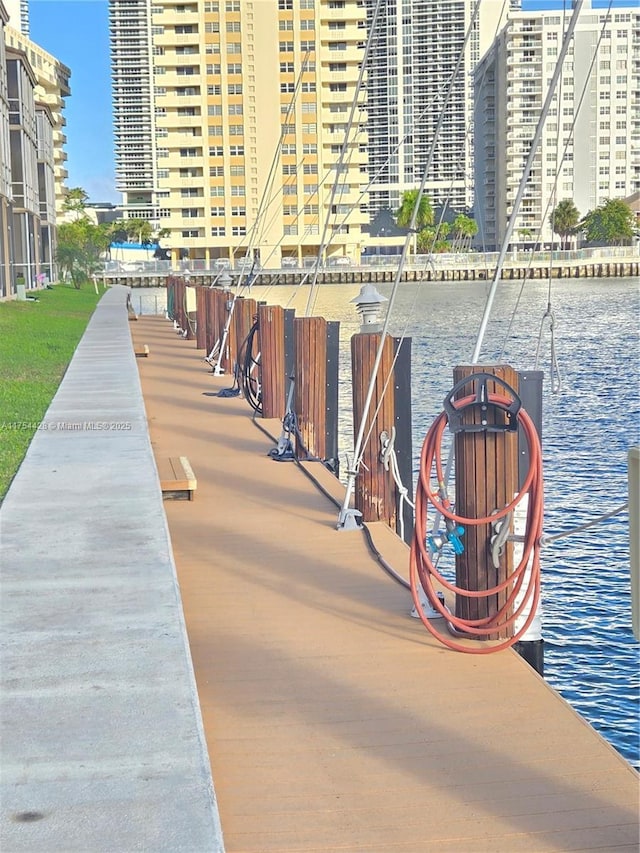 surrounding community featuring a view of city and a water view