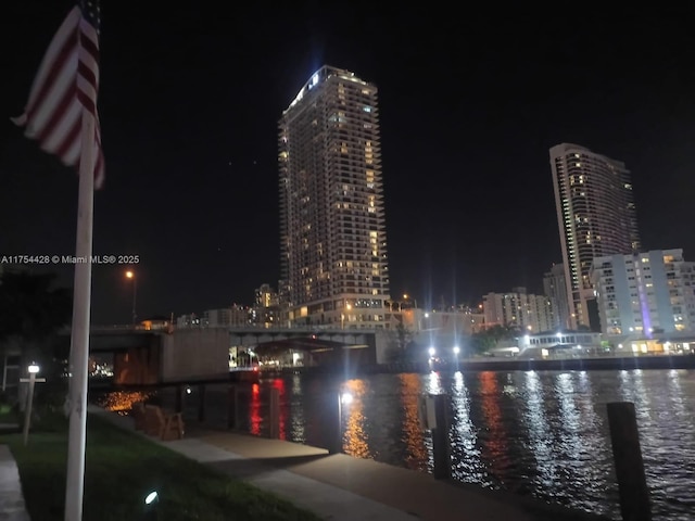 property's view of city featuring a water view