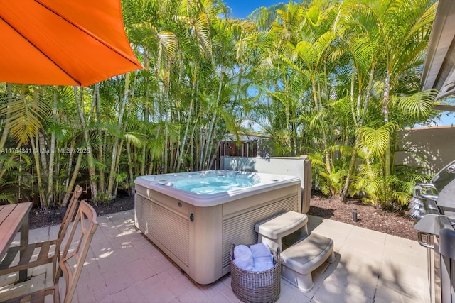 view of patio / terrace featuring a hot tub