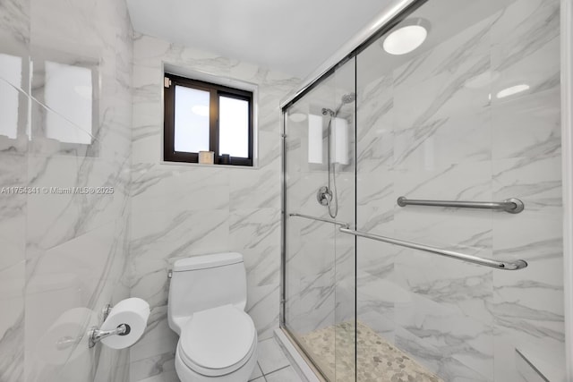 full bathroom featuring toilet and a marble finish shower