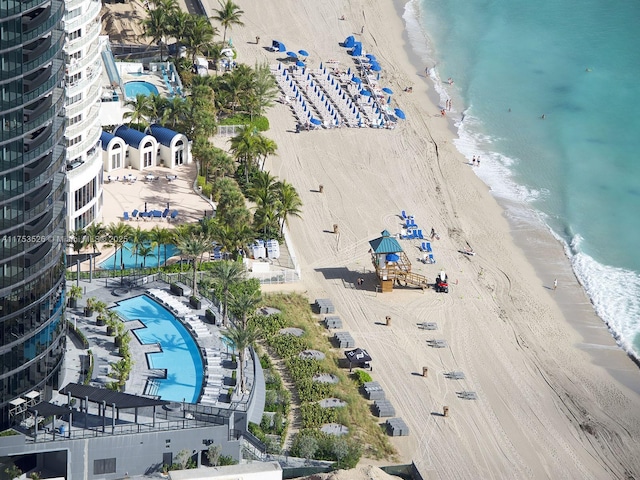 bird's eye view with a view of the beach and a water view