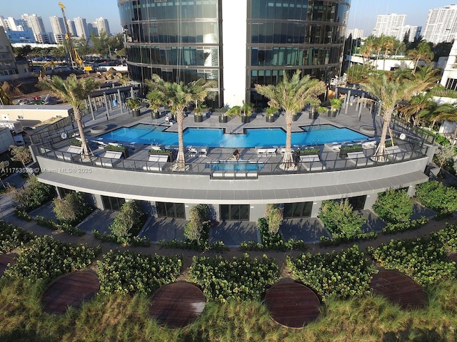 pool with a view of city and a patio