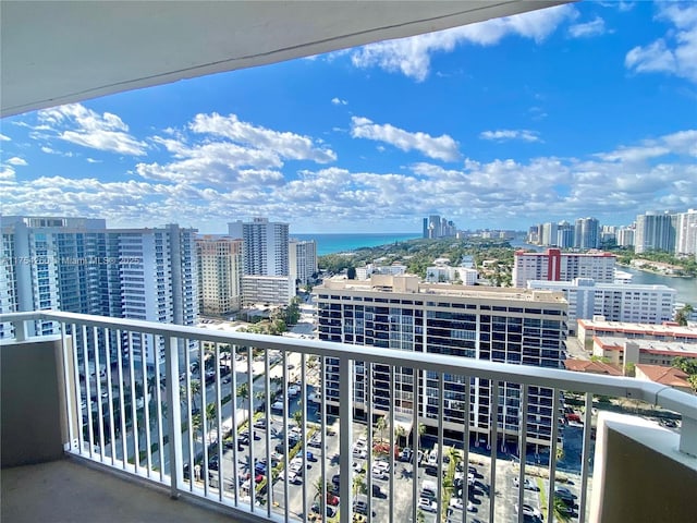 balcony featuring a view of city and a water view