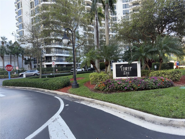 community / neighborhood sign with a lawn