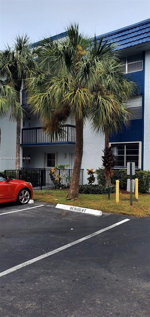 3160 Holiday Springs Blvd Unit 7-112, Margate, FL 33063 - view of property with uncovered parking