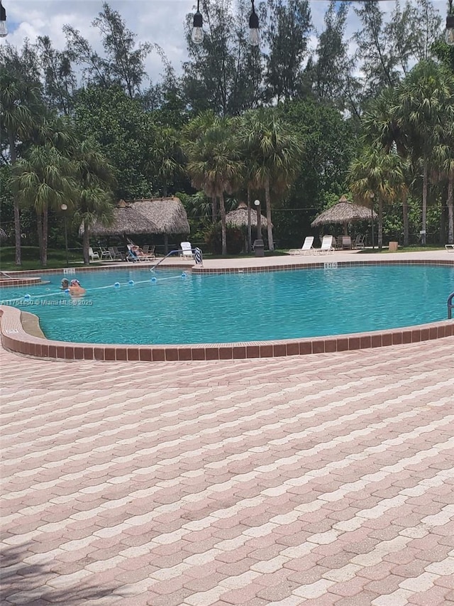 3160 Holiday Springs Blvd Unit 7-112, Margate, FL 33063 - community pool featuring a gazebo