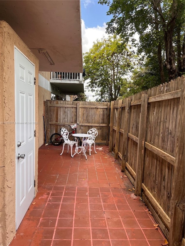 300 NW 107th Ave Unit 106, Miami, FL 33172 - view of patio / terrace featuring a fenced backyard
