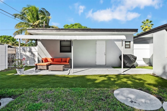 back of house featuring a yard, a patio area, fence, and stucco siding