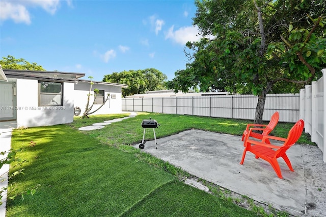 view of yard with a fenced backyard and a patio