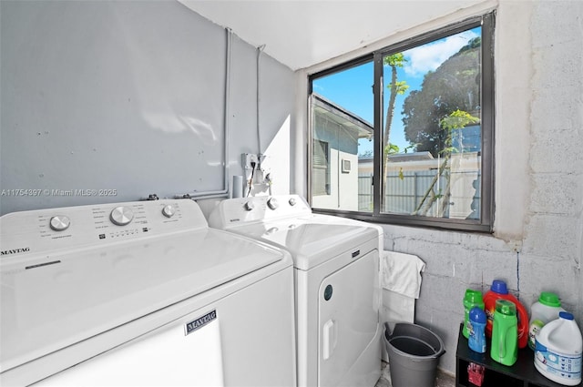 laundry area featuring laundry area and washer and clothes dryer