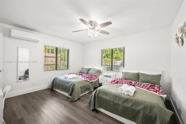 bedroom with wood finished floors, ceiling fan, baseboards, and a wall mounted AC