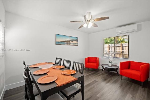 dining room with a ceiling fan, wood finished floors, baseboards, and a wall mounted AC