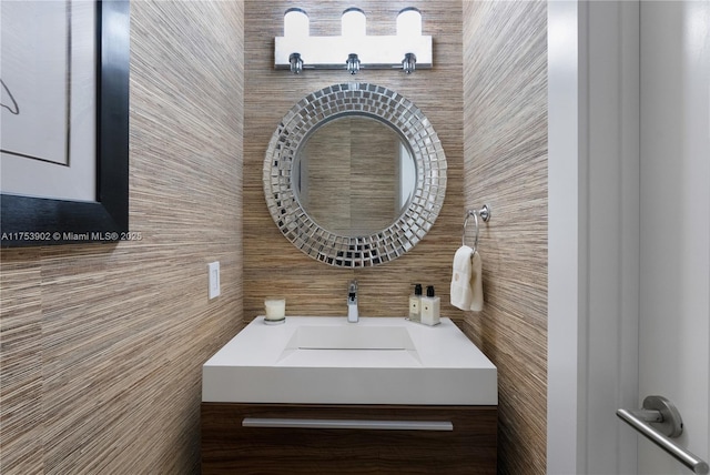 bathroom with tile walls and vanity