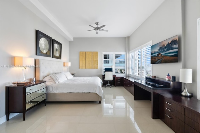 bedroom featuring ceiling fan, built in desk, and light tile patterned flooring