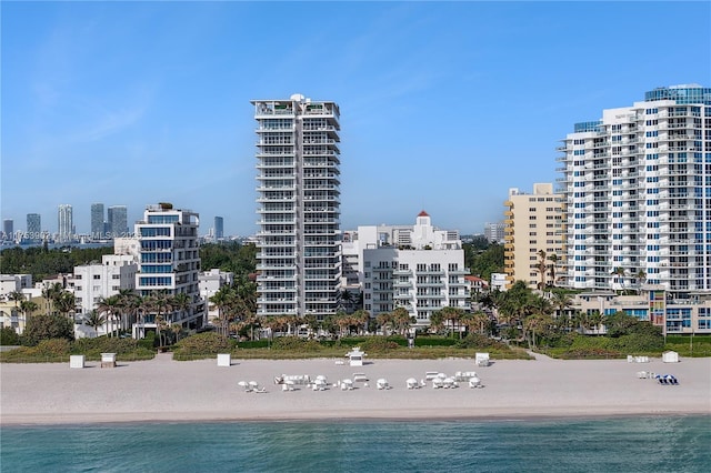 water view featuring a beach view and a city view