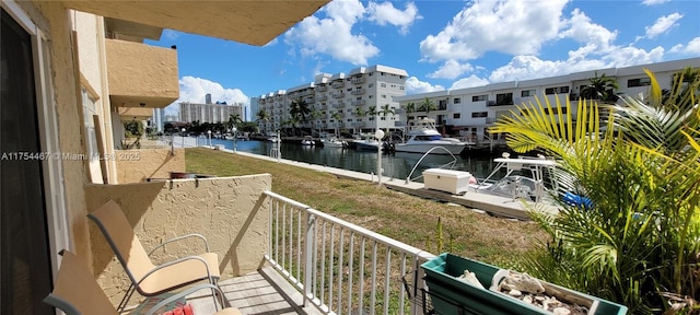 balcony featuring a water view