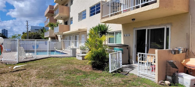 view of swimming pool with fence