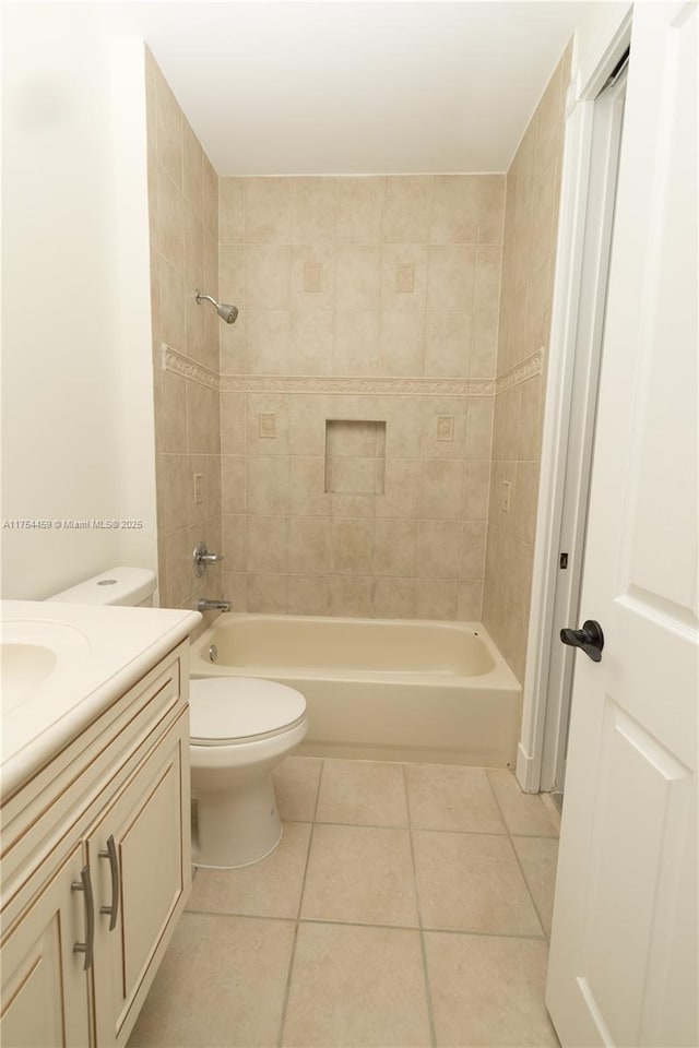 full bathroom featuring  shower combination, tile patterned flooring, toilet, and vanity