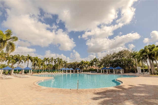 community pool with a patio area