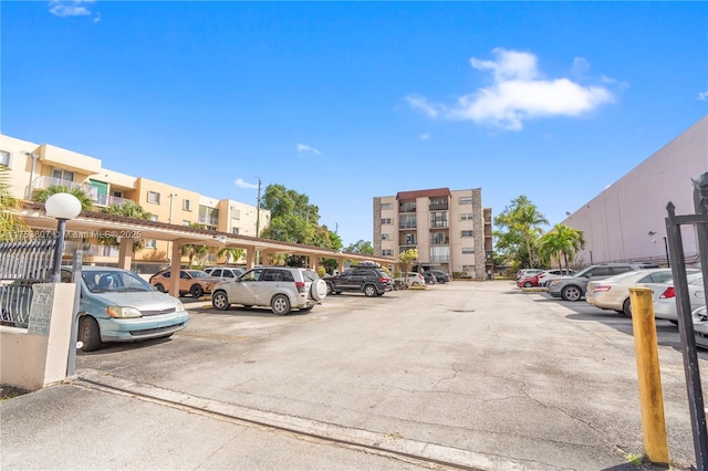 view of partially covered parking lot