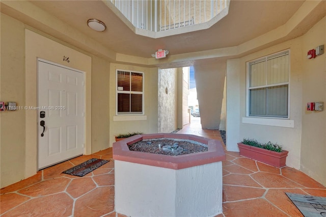 entrance to property featuring a patio