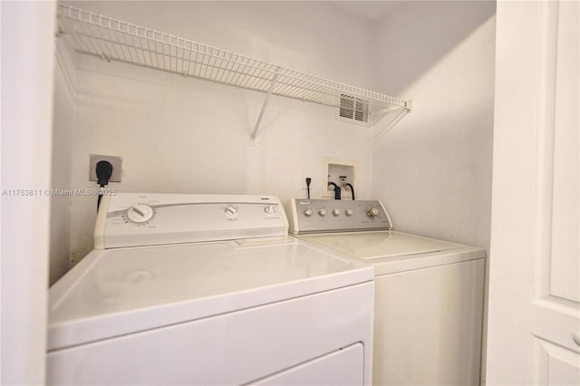 laundry area with laundry area and independent washer and dryer