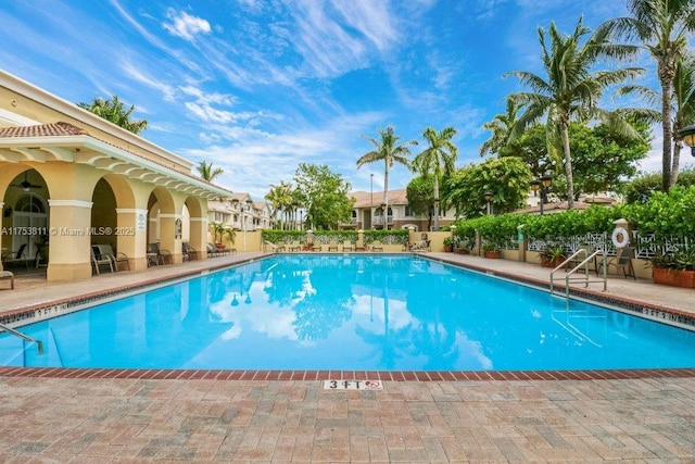 community pool with a patio area