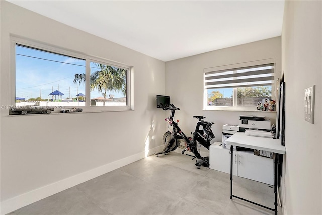 workout room with baseboards