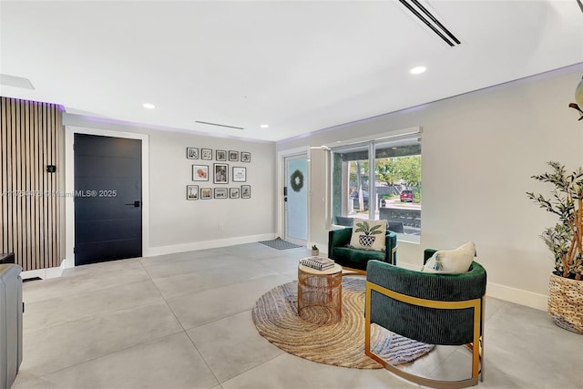 sitting room with recessed lighting, visible vents, and baseboards