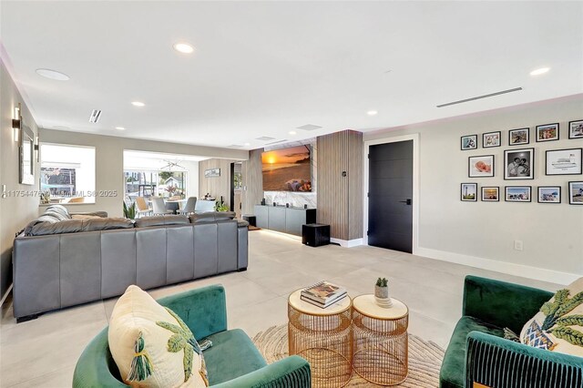 living area featuring recessed lighting, visible vents, baseboards, and light tile patterned flooring