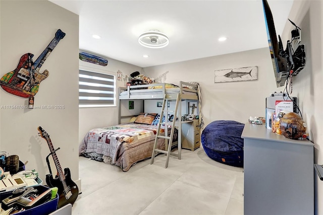 bedroom with recessed lighting and concrete floors