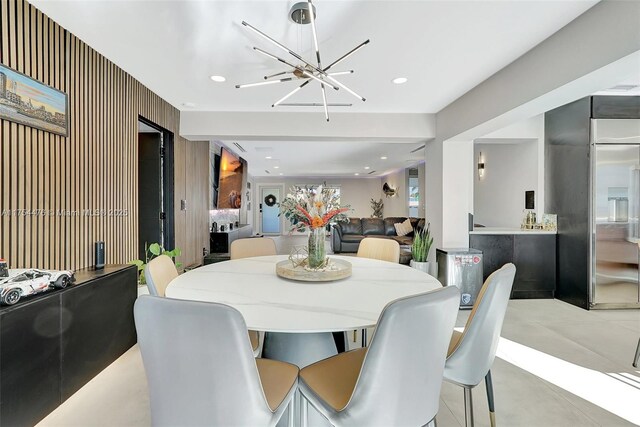 dining space with a chandelier and recessed lighting