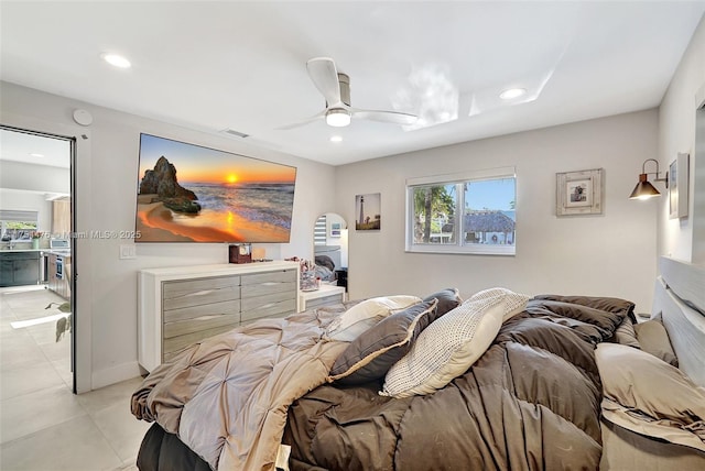 bedroom featuring arched walkways, recessed lighting, visible vents, ceiling fan, and baseboards