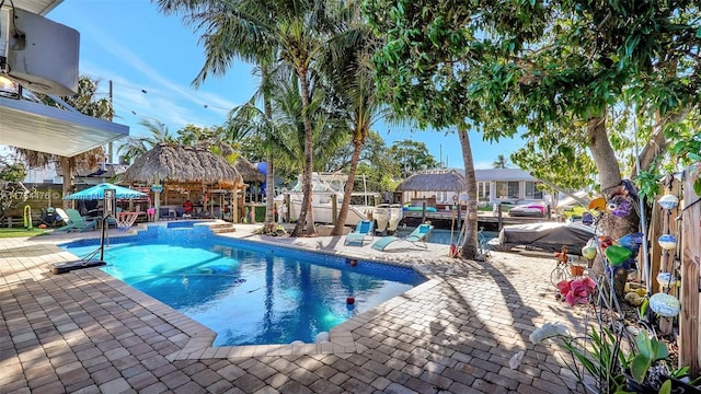 view of pool with a patio, a gazebo, and a pool with connected hot tub