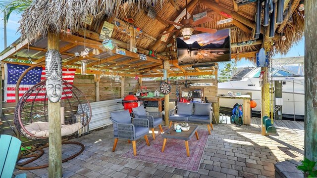 view of patio / terrace with ceiling fan, outdoor lounge area, and a gazebo