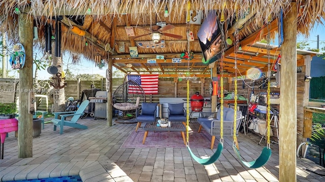 view of patio featuring ceiling fan and a gazebo