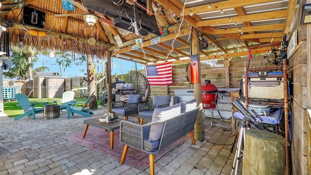 view of patio / terrace with outdoor lounge area and a gazebo