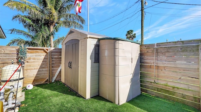 view of outdoor structure with a fenced backyard