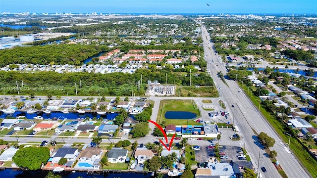 bird's eye view featuring a water view and a residential view