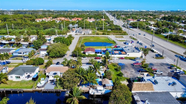 drone / aerial view with a water view and a residential view