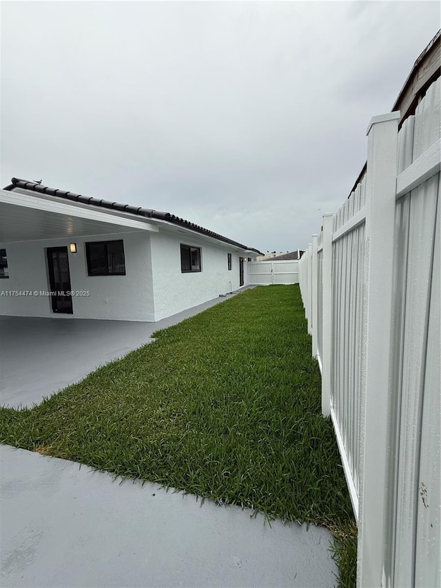 view of yard with a fenced backyard