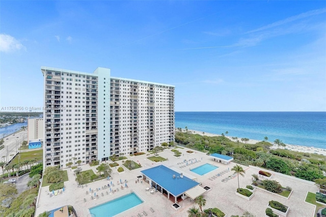 birds eye view of property with a water view