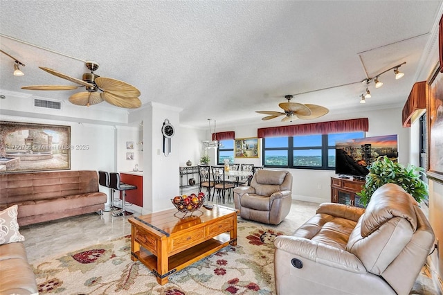 1201 S Ocean Dr Unit 1711S, Hollywood, FL 33019 - living room with visible vents, a ceiling fan, ornamental molding, rail lighting, and a textured ceiling