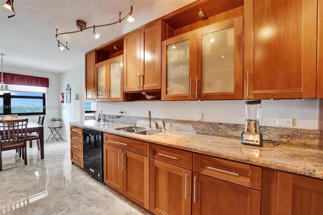 1201 S Ocean Dr Unit 1711S, Hollywood, FL 33019 - kitchen with light stone counters, a sink, and brown cabinets